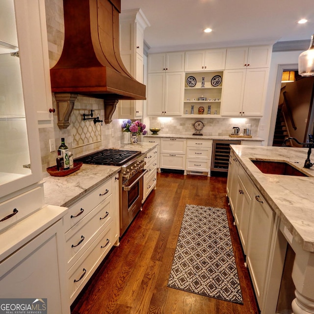 1178 Chambord Way NE, Brookhaven, GA 30319 - kitchen featuring high end stainless steel range, wine cooler, custom range hood, a sink, and white cabinets