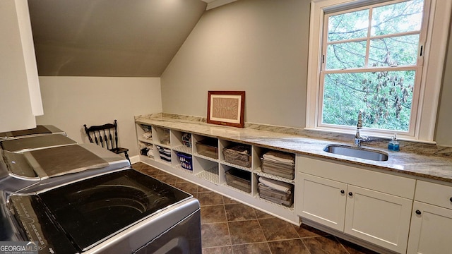 1178 Chambord Way NE, Brookhaven, GA 30319 - laundry area with washing machine and dryer, healthy amount of natural light, cabinet space, and dark tile patterned floors