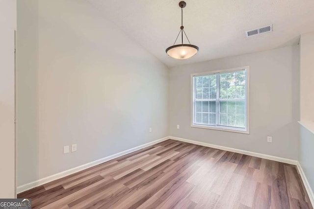 275 Mountain Way, Covington, GA 30016 - unfurnished room featuring wood finished floors and lofted ceiling