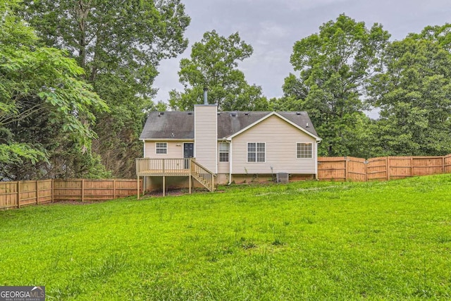 275 Mountain Way, Covington, GA 30016 - back of property with a chimney, a fenced backyard, a wooden deck, and stairway