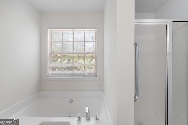 225 Chinns Way, Hampton, GA 30228 - full bathroom featuring a shower stall and a garden tub