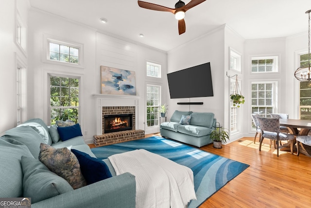 1421 Lane Creek Dr, Bishop, GA 30621 - living room featuring crown molding, a towering ceiling, light wood-style flooring, healthy amount of natural light, and a ceiling fan