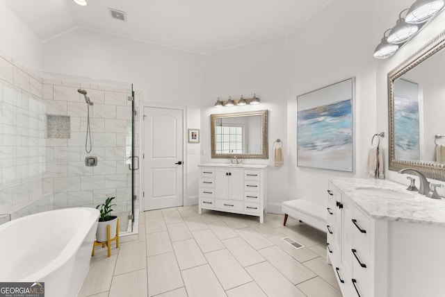 1421 Lane Creek Dr, Bishop, GA 30621 - full bathroom featuring a shower stall, a soaking tub, two vanities, tile patterned flooring, and lofted ceiling