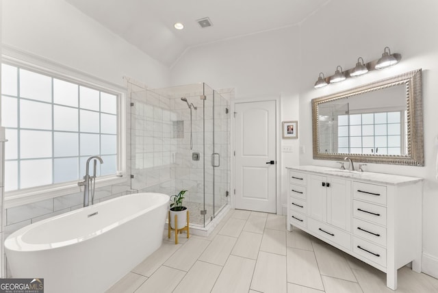 1421 Lane Creek Dr, Bishop, GA 30621 - full bathroom featuring a freestanding tub, a shower stall, vanity, lofted ceiling, and tile patterned floors