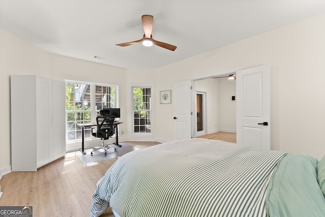 1421 Lane Creek Dr, Bishop, GA 30621 - bedroom with light wood-style flooring, a desk, baseboards, and ceiling fan
