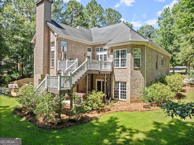 1421 Lane Creek Dr, Bishop, GA 30621 - back of property featuring stairway, brick siding, a wooden deck, and a lawn