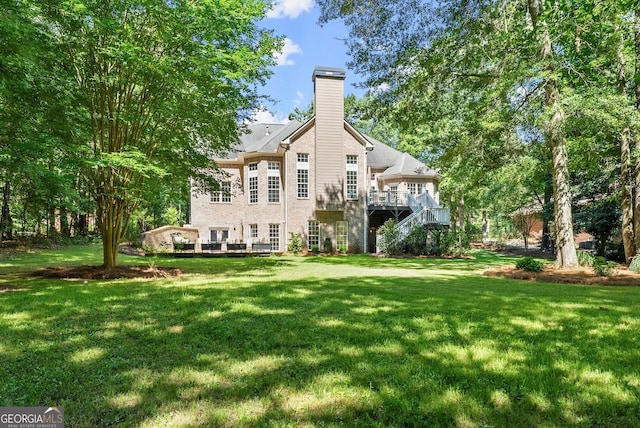 1421 Lane Creek Dr, Bishop, GA 30621 - back of house featuring a deck, a chimney, a yard, and stairway