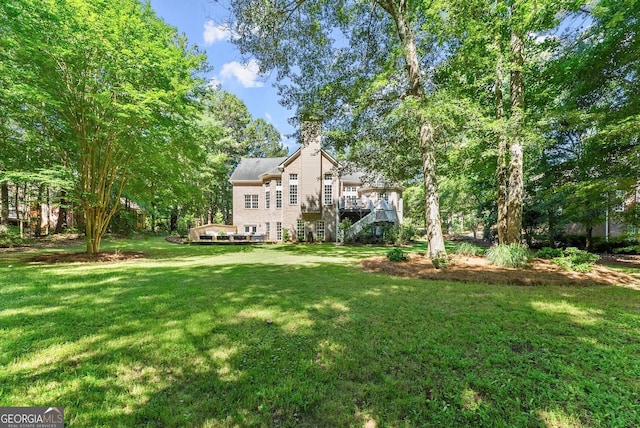 1421 Lane Creek Dr, Bishop, GA 30621 - view of green lawn with stairs and a deck
