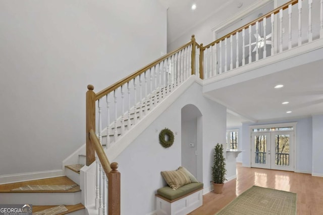 100 Oboe Ct, Ellijay, GA 30540 - stairs with arched walkways, wood finished floors, baseboards, recessed lighting, and french doors