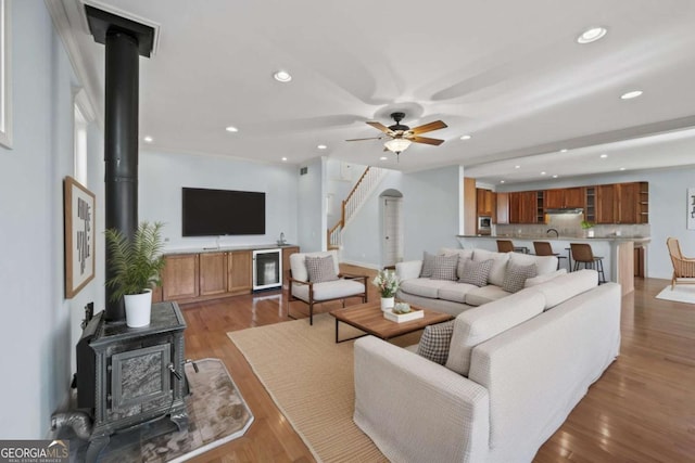 100 Oboe Ct, Ellijay, GA 30540 - living room featuring a wood stove, recessed lighting, a ceiling fan, beverage cooler, and wood finished floors