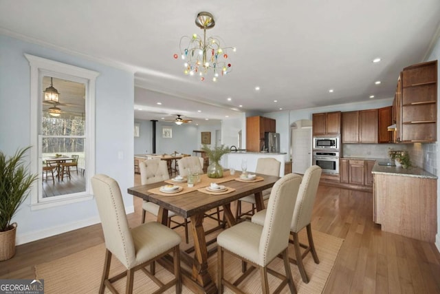 100 Oboe Ct, Ellijay, GA 30540 - dining room featuring light wood-style flooring, arched walkways, ceiling fan, recessed lighting, and a chandelier
