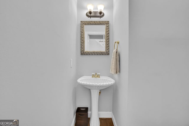1304 Swallows Walk, Grayson, GA 30017 - bathroom with baseboards and wood finished floors