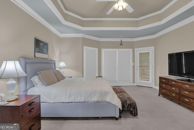 1304 Swallows Walk, Grayson, GA 30017 - bedroom with carpet floors, a tray ceiling, crown molding, ceiling fan, and baseboards