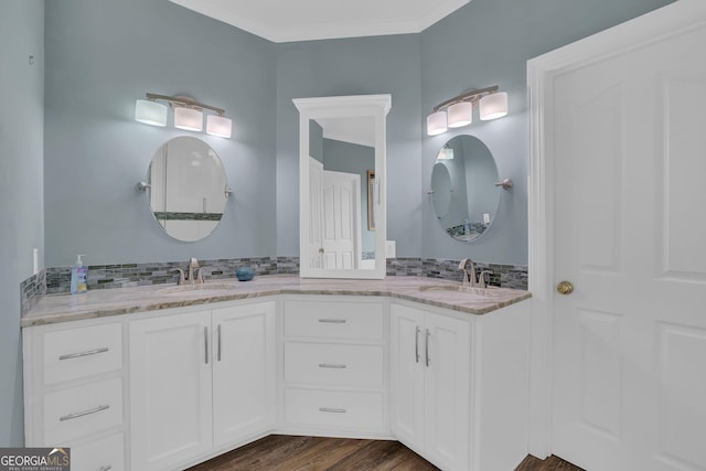 1304 Swallows Walk, Grayson, GA 30017 - bathroom with double vanity, wood finished floors, tasteful backsplash, and ornamental molding