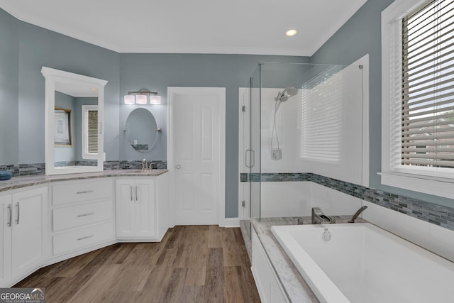 1304 Swallows Walk, Grayson, GA 30017 - full bathroom with double vanity, a garden tub, a stall shower, plenty of natural light, and recessed lighting