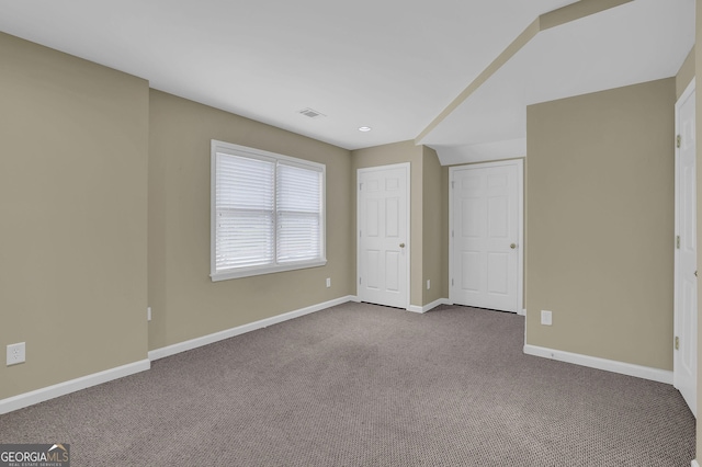 1304 Swallows Walk, Grayson, GA 30017 - unfurnished bedroom with dark colored carpet, baseboards, and recessed lighting