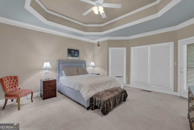 1304 Swallows Walk, Grayson, GA 30017 - carpeted bedroom with a tray ceiling, crown molding, ceiling fan, and baseboards