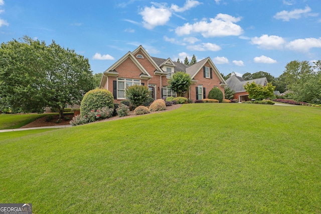 1304 Swallows Walk, Grayson, GA 30017 - view of front facade with brick siding and a front yard