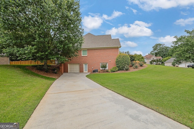 1304 Swallows Walk, Grayson, GA 30017 - view of home's exterior with driveway, brick siding, a garage, and central air condition unit