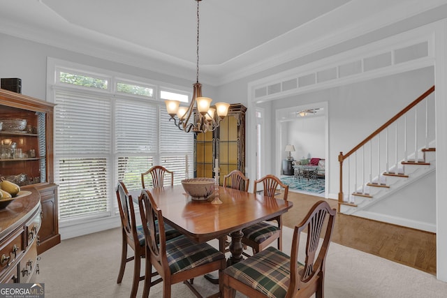1304 Swallows Walk, Grayson, GA 30017 - dining space with a chandelier, plenty of natural light, stairs, ornamental molding, and light colored carpet