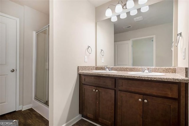 422 Dublin Way, Dallas, GA 30132 - bathroom featuring double vanity, an enclosed shower, and baseboards