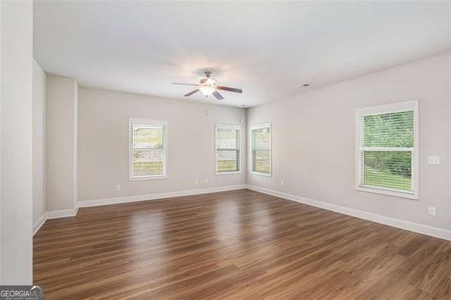 422 Dublin Way, Dallas, GA 30132 - empty room featuring a ceiling fan, wood finished floors, and baseboards