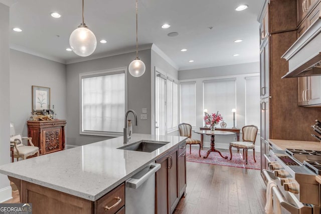 345 Glen Iris Dr NE Unit 3, Atlanta, GA 30312 - kitchen with custom range hood, appliances with stainless steel finishes, crown molding, light stone countertops, and dark wood-style flooring