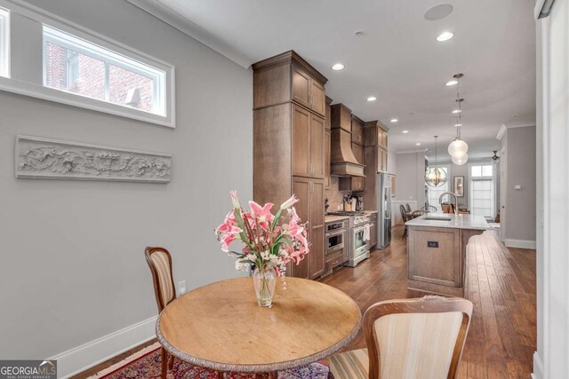 345 Glen Iris Dr NE Unit 3, Atlanta, GA 30312 - dining space featuring hardwood / wood-style floors, recessed lighting, and crown molding