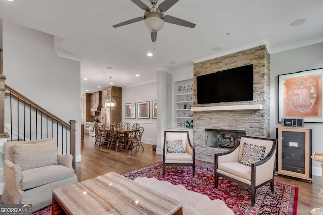 345 Glen Iris Dr NE Unit 3, Atlanta, GA 30312 - living room with wine cooler, wood finished floors, crown molding, ceiling fan, and stairway