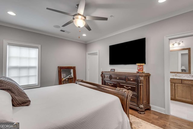 345 Glen Iris Dr NE Unit 3, Atlanta, GA 30312 - bedroom with light wood-type flooring, connected bathroom, recessed lighting, ornamental molding, and ceiling fan
