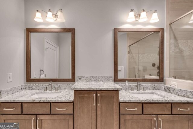 345 Glen Iris Dr NE Unit 3, Atlanta, GA 30312 - full bathroom featuring two vanities, a stall shower, and a chandelier
