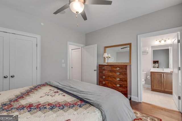 345 Glen Iris Dr NE Unit 3, Atlanta, GA 30312 - bedroom featuring wood finished floors, a closet, a ceiling fan, and connected bathroom