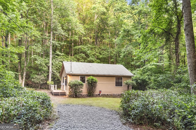 62 Nocona Trl, Ellijay, GA 30536 - view of side of home featuring a forest view and a deck