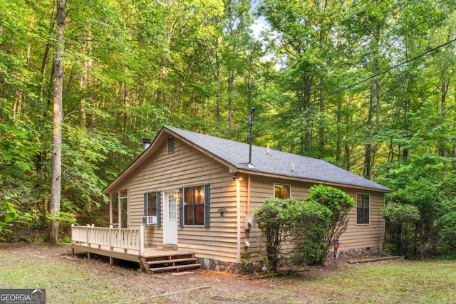 62 Nocona Trl, Ellijay, GA 30536 - view of front of property featuring a deck, a wooded view, and cooling unit