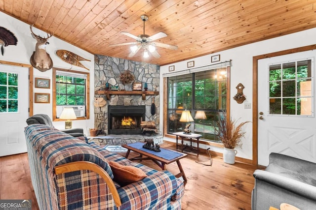 62 Nocona Trl, Ellijay, GA 30536 - living area with wooden ceiling, a stone fireplace, ceiling fan, hardwood / wood-style flooring, and cooling unit