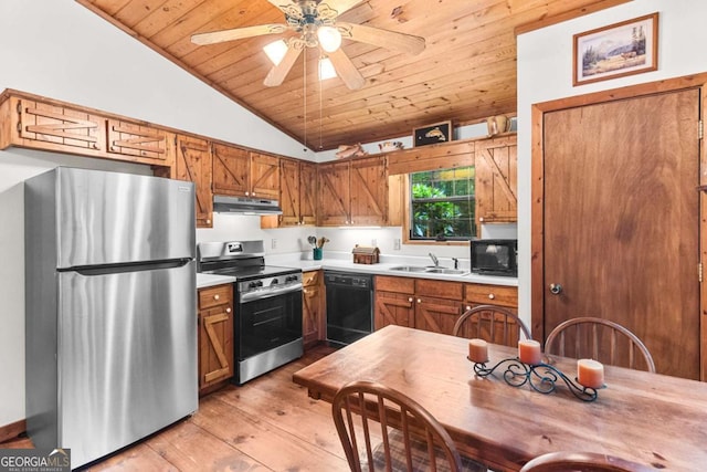 62 Nocona Trl, Ellijay, GA 30536 - kitchen with black appliances, under cabinet range hood, wood ceiling, light wood finished floors, and light countertops