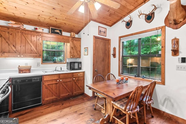 62 Nocona Trl, Ellijay, GA 30536 - kitchen featuring black appliances, a sink, vaulted ceiling, light wood finished floors, and brown cabinetry