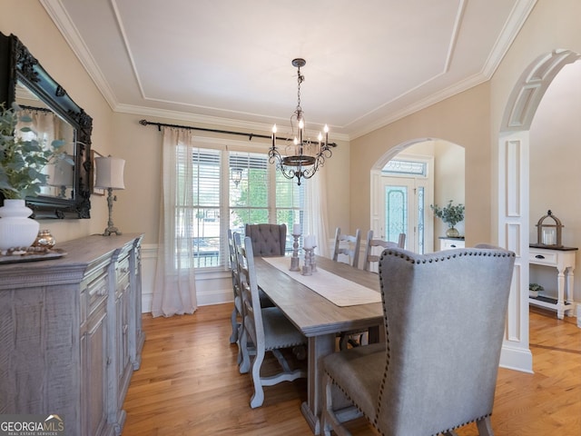 70 Baker Pond Ct, Jefferson, GA 30549 - dining area with arched walkways, plenty of natural light, a chandelier, light wood finished floors, and ornamental molding