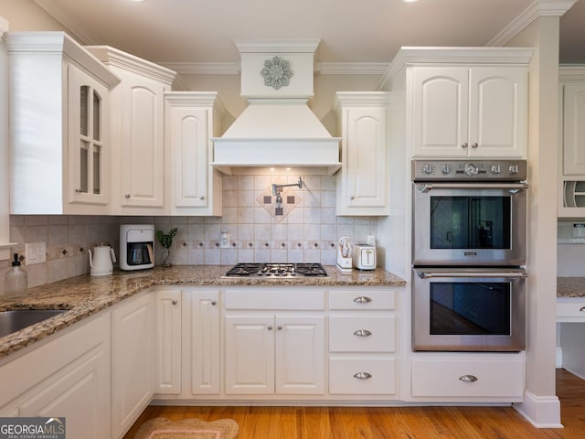 70 Baker Pond Ct, Jefferson, GA 30549 - kitchen featuring stainless steel appliances, white cabinets, glass insert cabinets, and crown molding