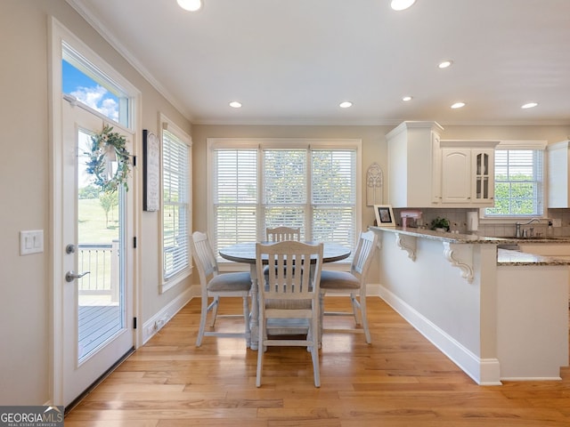 70 Baker Pond Ct, Jefferson, GA 30549 - dining room with crown molding, recessed lighting, light wood-style flooring, and baseboards