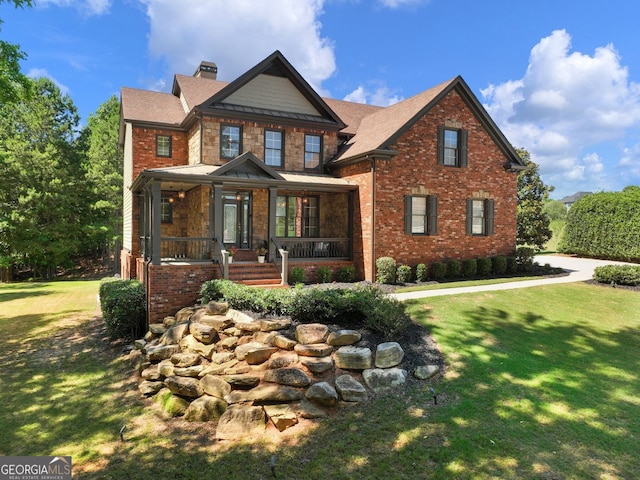 70 Baker Pond Ct, Jefferson, GA 30549 - craftsman house with a chimney, a front lawn, covered porch, and brick siding