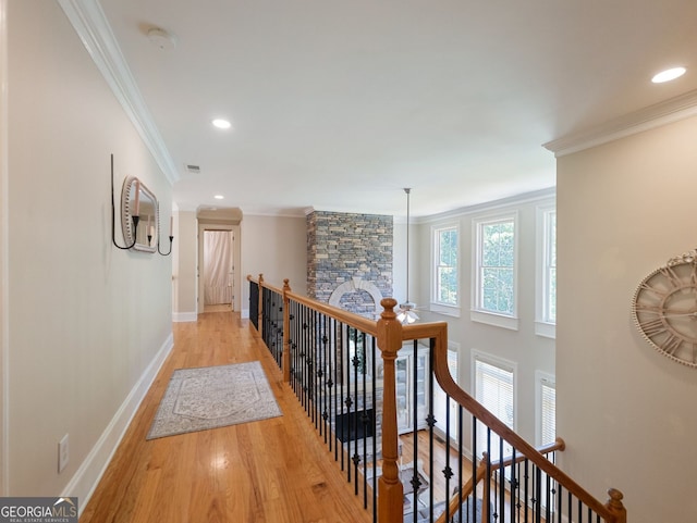 70 Baker Pond Ct, Jefferson, GA 30549 - corridor featuring an upstairs landing, light wood finished floors, baseboards, ornamental molding, and recessed lighting