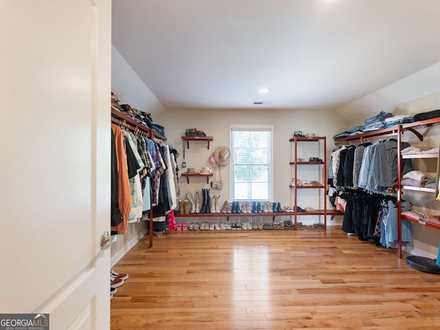 70 Baker Pond Ct, Jefferson, GA 30549 - spacious closet with lofted ceiling and wood finished floors