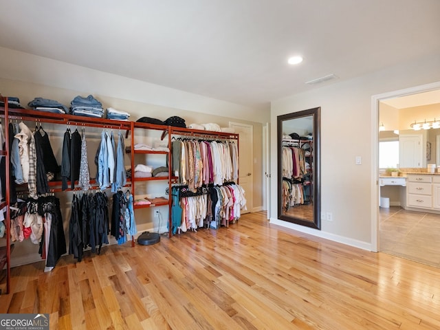 70 Baker Pond Ct, Jefferson, GA 30549 - walk in closet with light wood finished floors