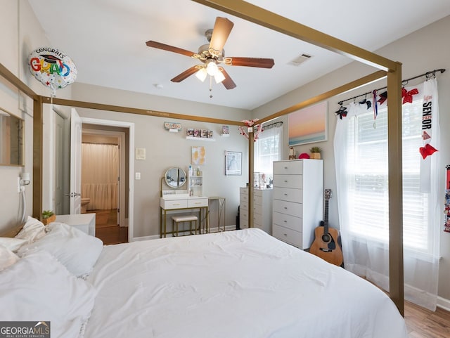 70 Baker Pond Ct, Jefferson, GA 30549 - bedroom featuring wood finished floors, a ceiling fan, and baseboards