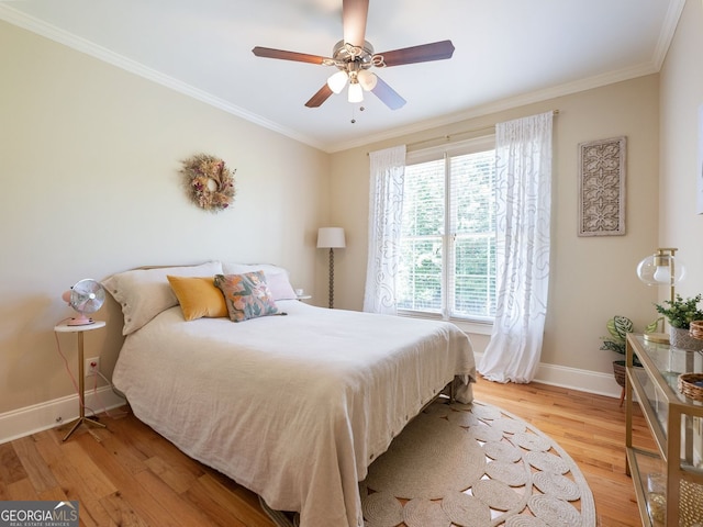 70 Baker Pond Ct, Jefferson, GA 30549 - bedroom with baseboards, light wood-style floors, ornamental molding, and a ceiling fan