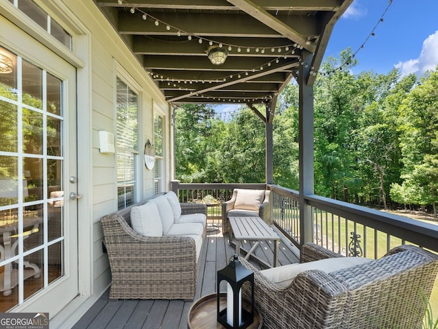 70 Baker Pond Ct, Jefferson, GA 30549 - deck with outdoor lounge area and view of wooded area