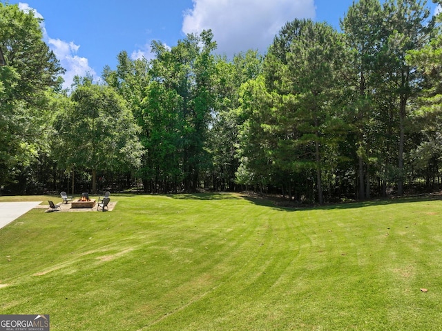 70 Baker Pond Ct, Jefferson, GA 30549 - view of green lawn featuring a fire pit