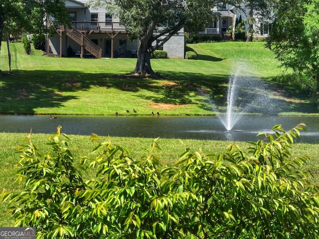 70 Baker Pond Ct, Jefferson, GA 30549 - surrounding community with a yard, stairs, and a deck with water view