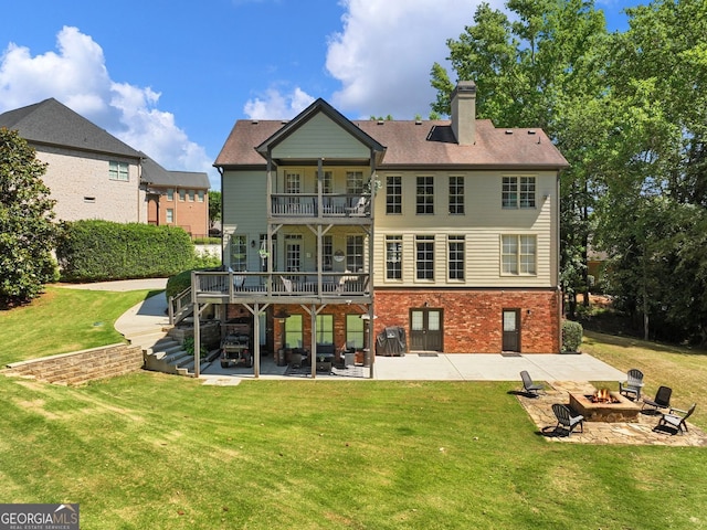 70 Baker Pond Ct, Jefferson, GA 30549 - back of property with a balcony, an outdoor fire pit, a patio, and a lawn